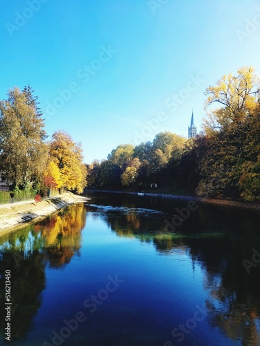 autumn trees reflected in water