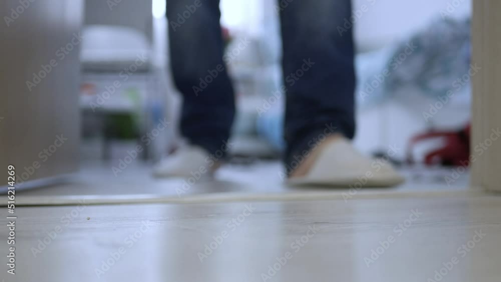 Putting a Postal Package in Front of the Door, Waiting for Postal Courier Delivery. Packages Delivering with Postal Services. Putting a Postal Package in Front of the Door, Waiting for Postal Courier Delivery. Packages Delivering with Postal Services.