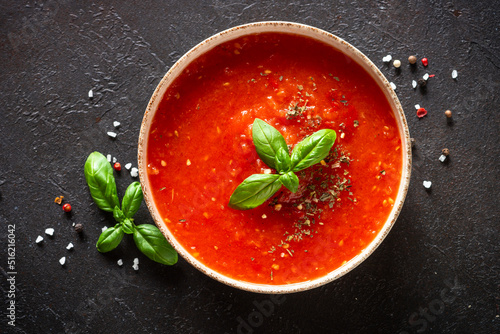 Fotografie Tomato soup on black background
