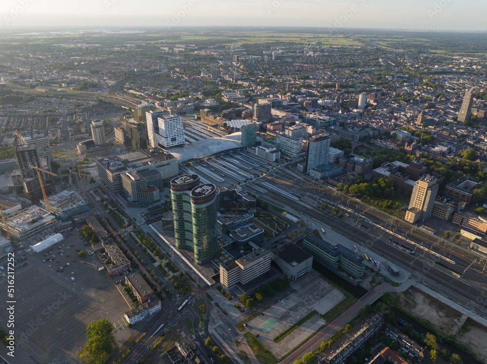 Utrecht skyline and central station public transport infrastructure and business district. Aerial drone overhead view. Tall buildings and towers downtown. Hoog Catharijne shopping center.