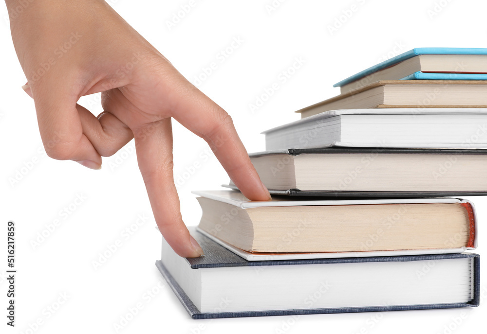 Woman imitating stepping up on books with her fingers against white background, closeup Woman imitating stepping up on books with her fingers against white background, closeup