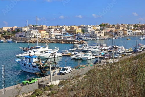View of the village overlooking the old port of Lampedusa. LAMPEDUSA, ITALY - AUGUST, 2019
