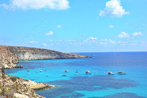 View of the most famous sea place of Lampedusa, Rabbits Beach or Conigli island. LAMPEDUSA, ITALY - AUGUST, 2019