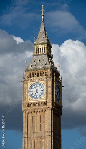 The evening sun shines on the Clock tower of the housers of parliament, commonly known as Big Ben photo