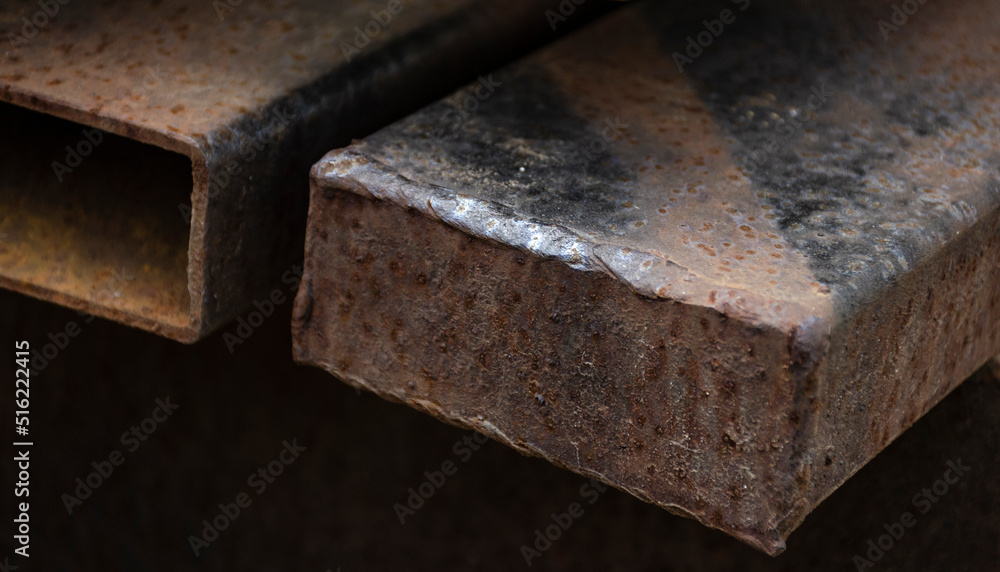 Steel profile in workshop. Rod made of metal. Steel part for construction production. Steel profile in workshop. Rod made of metal. Steel part for construction production.