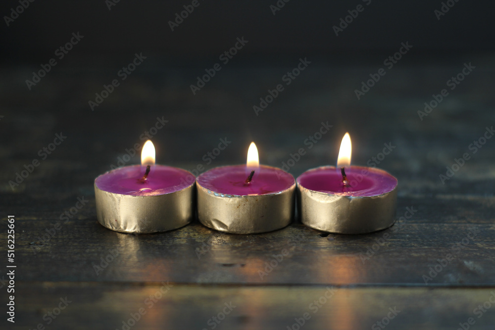 burning candle photo studio gold light of purple candle burning candle photo studio gold light of purple candle