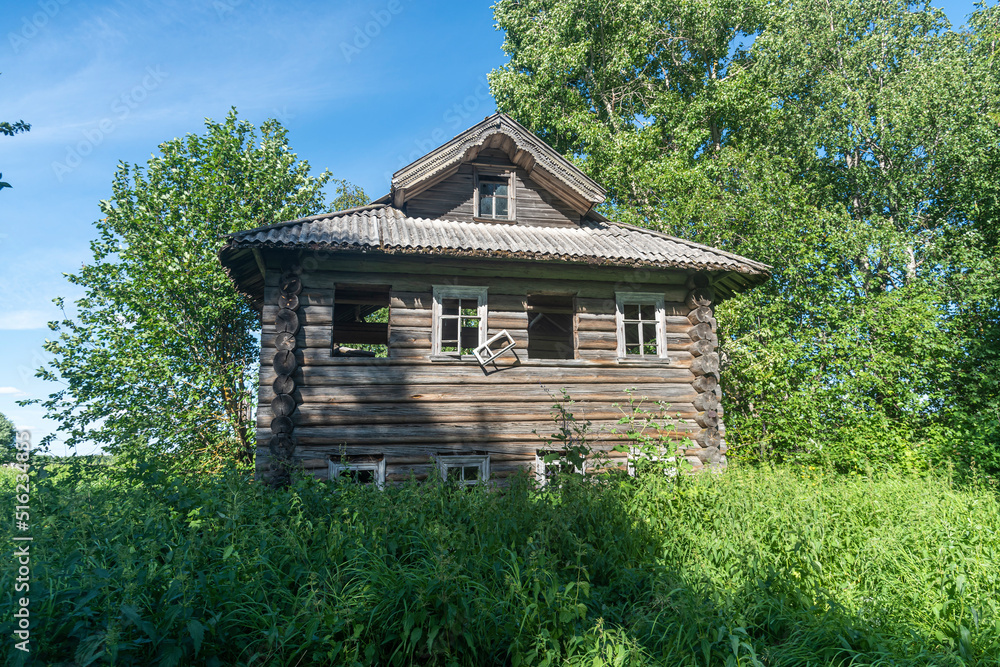 an old abandoned wooden log house in the Russian north in the Arkhangelsk region. an old abandoned wooden log house in the Russian north in the Arkhangelsk region.