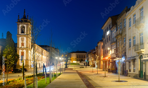 Evening photo of Av. Carvalho Araujo with turned on city lights. Main avenue of Vila Real, Portugal. photo