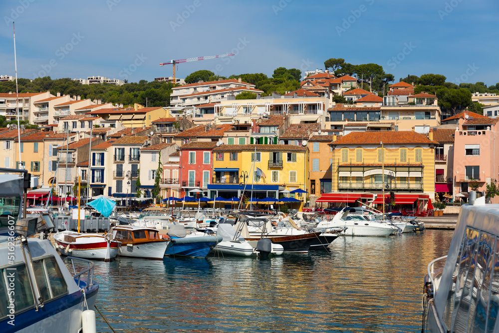 Landscape with yachts and fishing boats in harbour of Cassis on sunny summer day, Provence, France