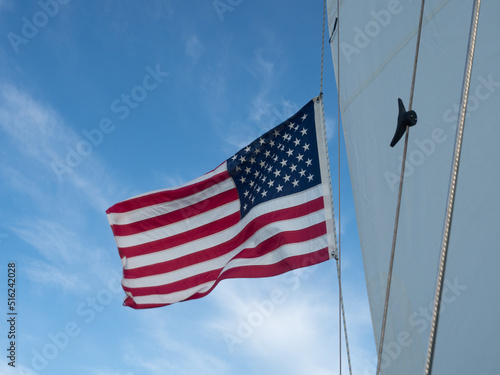 Tablou pe pânză Unfurled American Flag on a Sailboat