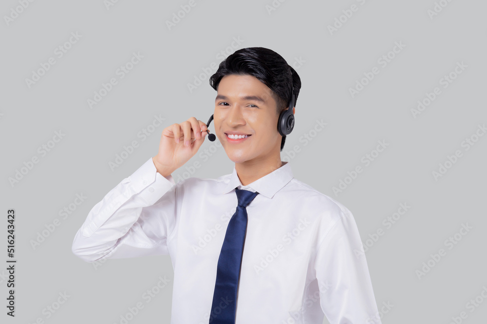 Portrait young asian business man call center wearing headset isolated on white background, agent with support and service, businessman is assistant for client with phone or helpline online. Portrait young asian business man call center wearing headset isolated on white background, agent with support and service, businessman is assistant for client with phone or helpline online.