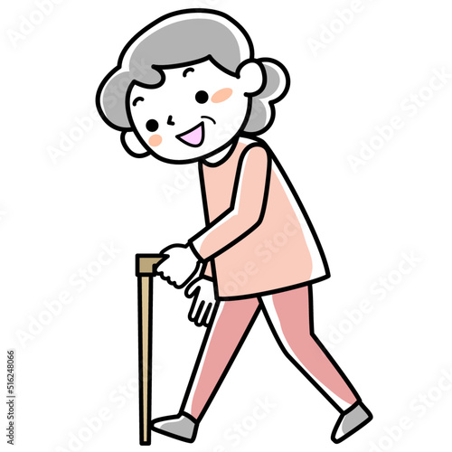 杖をついて歩く笑顔のシニア女性