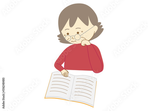 眼鏡をかけ、頬杖をついて本を読むおばあさん