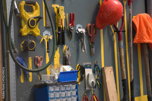 workshop tools hanging on the wall in a shed gardening equipment photo