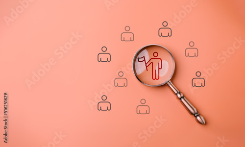 HRM or Human Resource Management, Magnifier glass focus to manager icon which is among staff icons for human development recruitment leadership and customer target group concept.