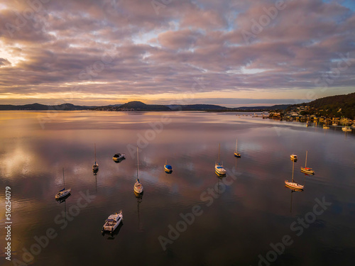 Wallpaper Mural Aerial sunrise waterscape with boats, reflections and cloud filled sky Torontodigital.ca