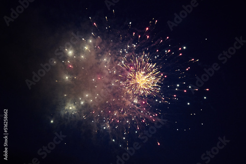 multicolored lights of fireworks exploding in the night sky