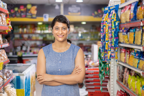 Photography Woman in grocery aisle of supermarket