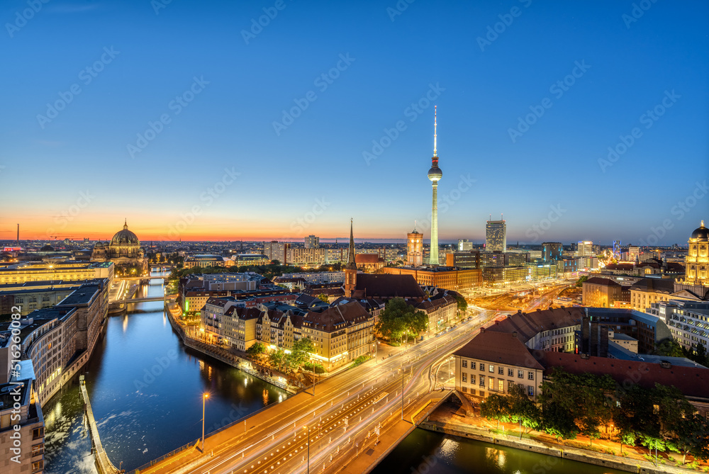 Downtown Berlin at twilight with the TV Tower, the river Spree and the cathedral