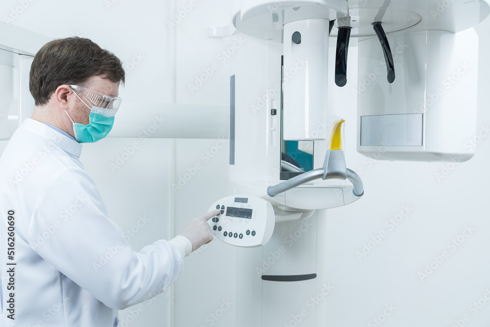 Caucasian male dentist wear mask standing prepare in dental exam room. Caucasian male dentist wear mask standing prepare in dental exam room.