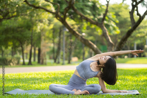 Portrait sport asian beauty body slim woman in sportswear sitting relax and girl practicing yoga and do fitness exercise in park at home.Diet concept.Fitness and healthy