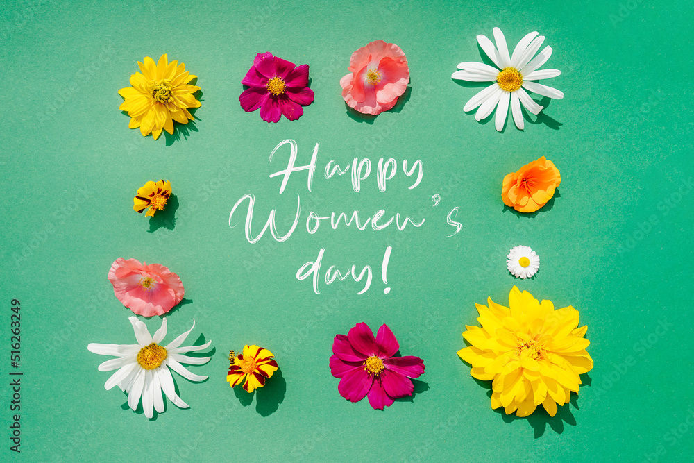 Flowers frame composition on green background with text. Flowers frame composition on green background with text.