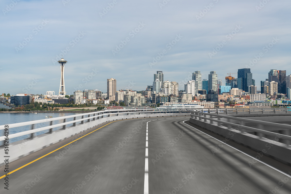 Empty urban asphalt road exterior with city buildings background. New modern highway concrete construction. Concept way to success. Transportation logistic industry fast delivery. Seattle. USA.