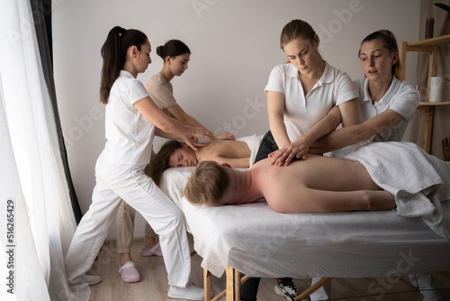Health wellness massage training.Teacher helping student training to become masseuse