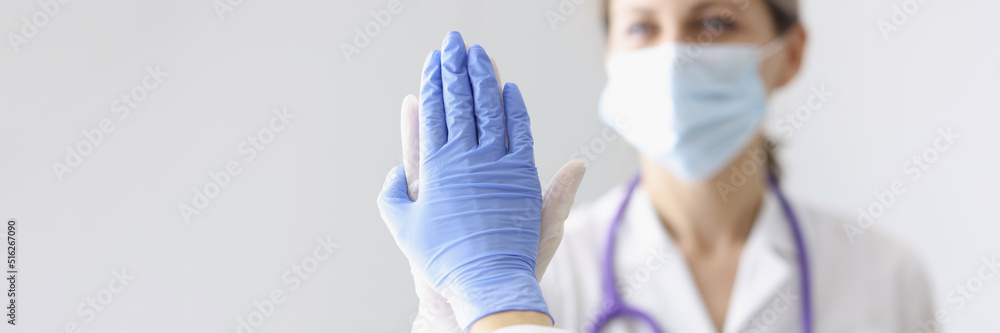 Medical coworkers give high five after successful surgery or diagnose to patient Medical coworkers give high five after successful surgery or diagnose to patient