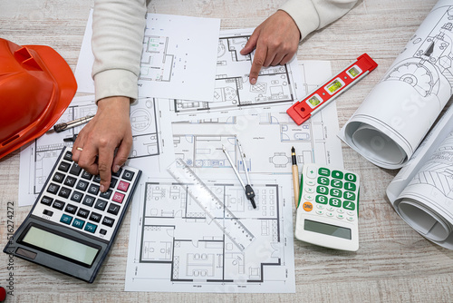 a man working on a drawing to create his home with professional design skills.