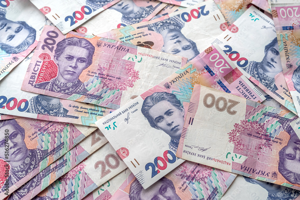 Fototapeta premium top view about a lot of Ukrainian hryvnia on the table.