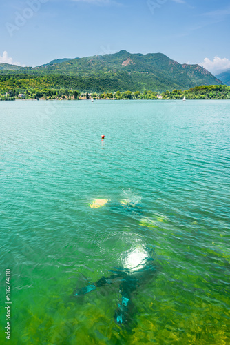 Divers submerged in the Lago Grande de Avigliana in the Piedmont region, Italy photo