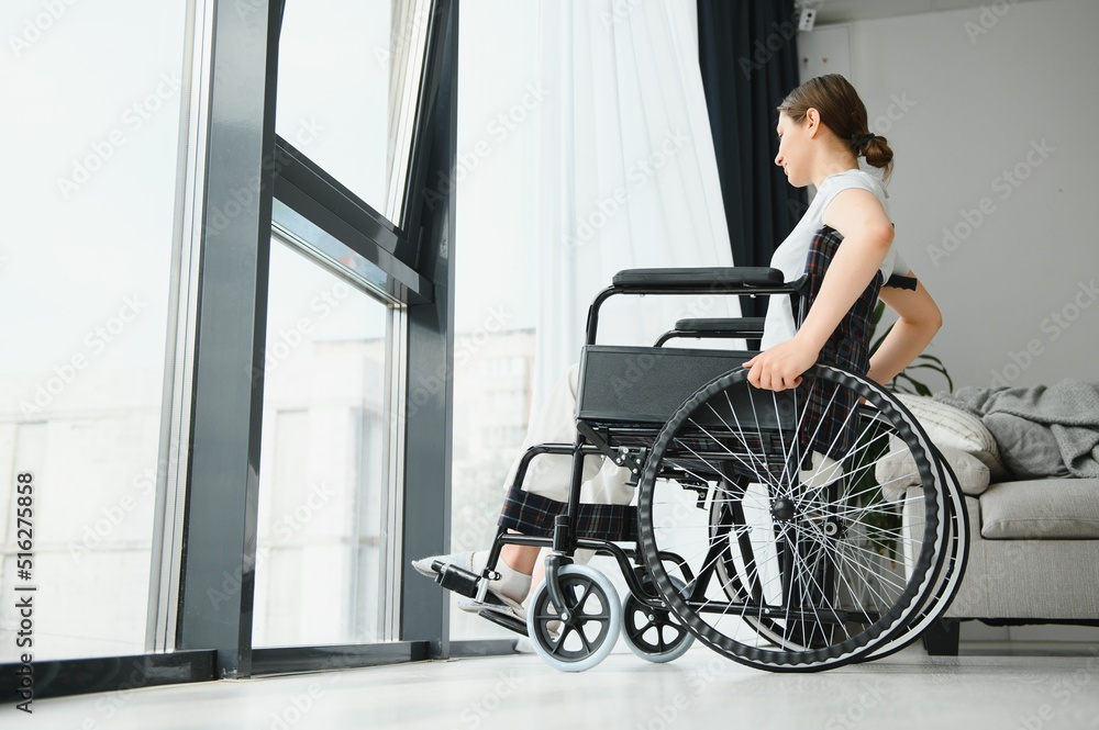 Young woman in wheelchair at home Young woman in wheelchair at home