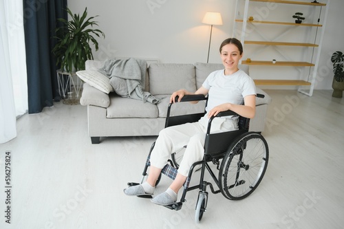 Brunette woman working out on wheelchair at home