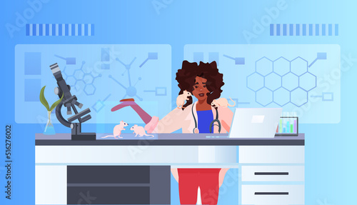 scientist or veterinary worker doing experiments in lab with experimental rat biological genetic engineering research