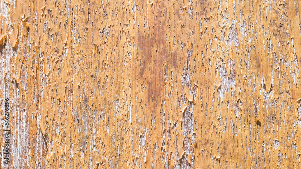 Old worn planked wooden fence texture background.