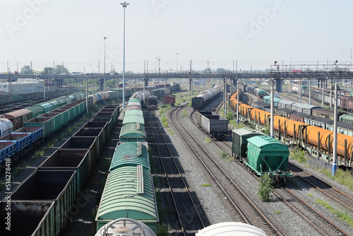 Russia, Chelyabinsk, July 08, 2022: Freight wagons with cargo at the railway station. Major transport railway junction. Sending wagons for export.
