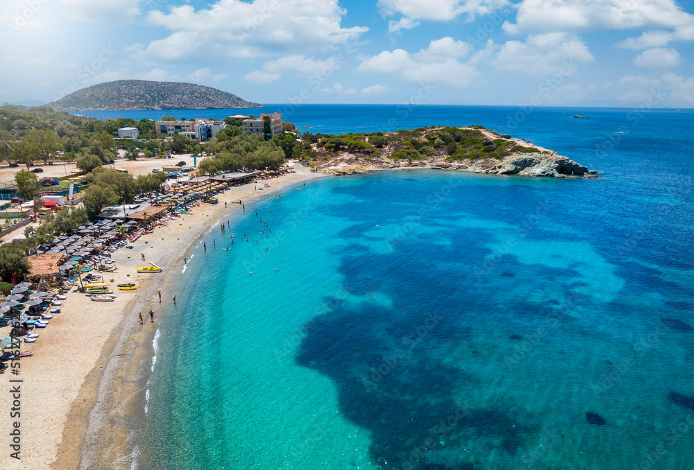 Obraz premium Aerial view of the popular Mavro Lithari beach at Saronida, Attica, Greece