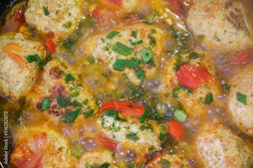 Homemade chicken cutlets are fried in a pan.