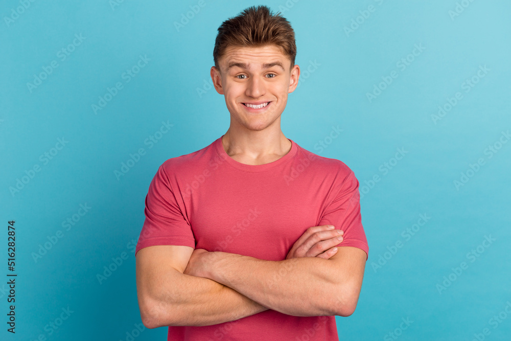Photo of young handsome man crossed hands confident intelligent promoter isolated over blue color background Photo of young handsome man crossed hands confident intelligent promoter isolated over blue color background