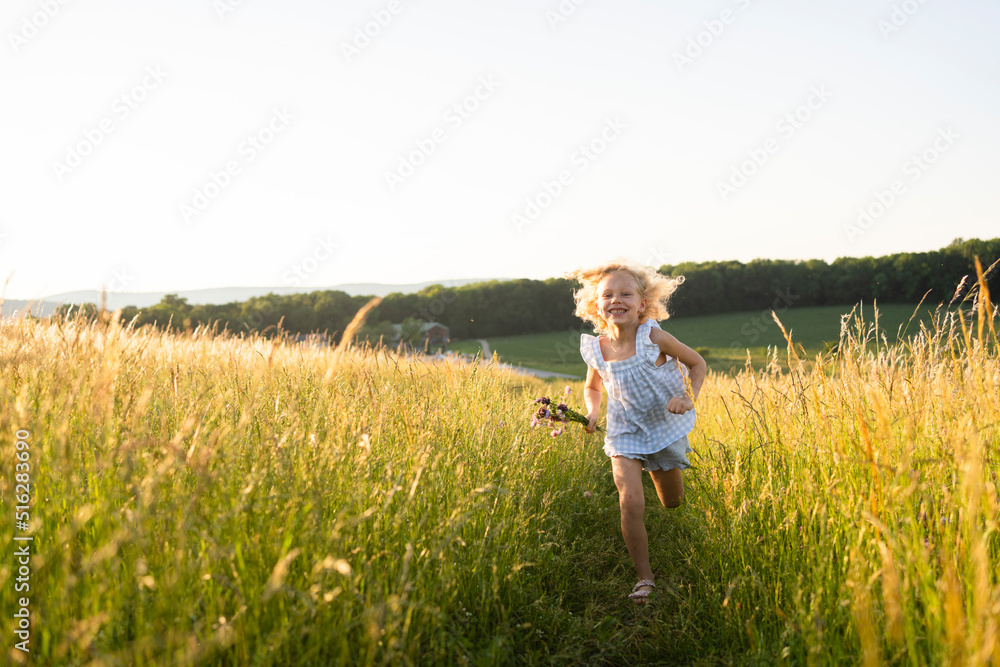 Happy girl running in field Happy girl running in field