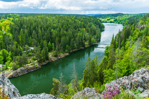 Sweden, Vastra Gotaland County, Scenic view of Gota Alv river and surrounding forest in summer photo