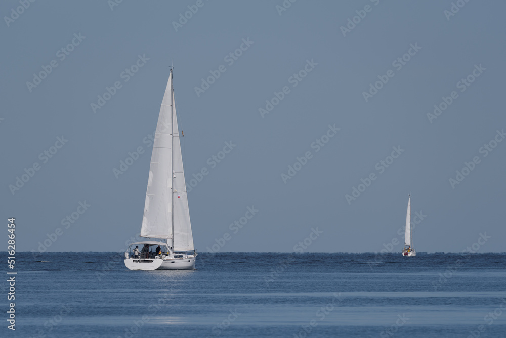 Obraz premium YACHTING - Sailors are sailing on the sea 