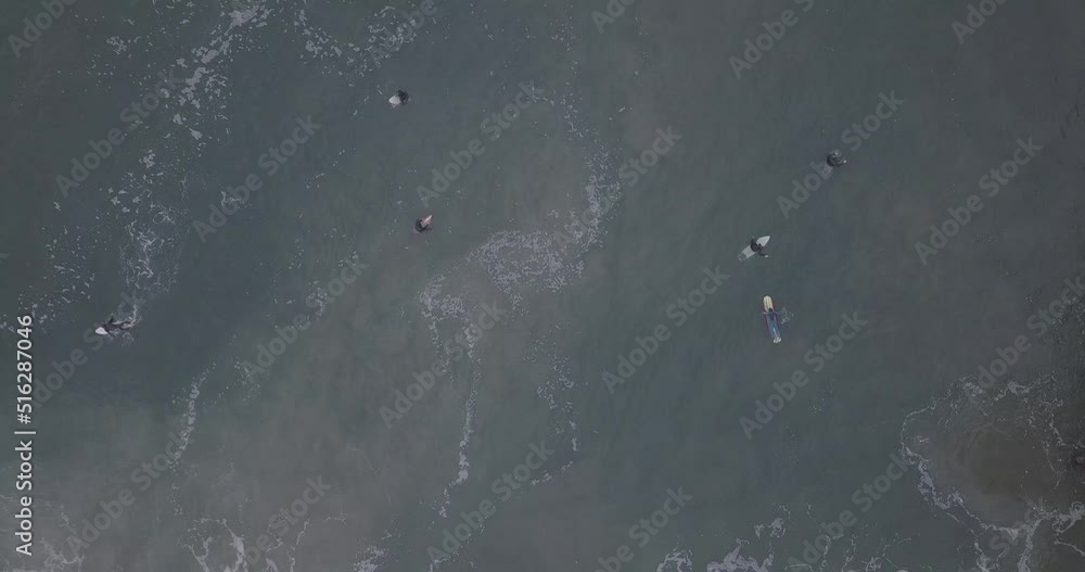 Overhead looking straight down on surfers Overhead looking straight down on surfers