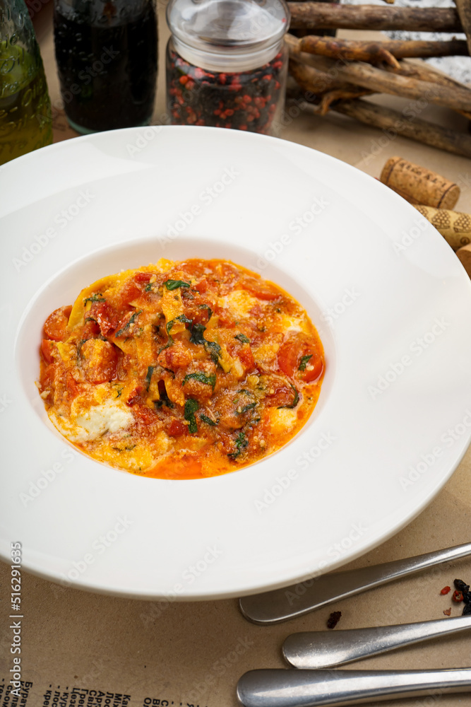 pasta in tomato sauce with cherry tomatoes sprinkled with cheese
pasta in tomato sauce with cherry tomatoes sprinkled with cheese