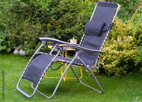 A deckchair on the lawn in the home garden