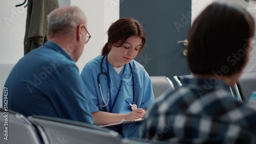 Wallpaper Mural Medical assistant doing consultation with senior patient in waiting area, sitting in hospital reception lobby. Female nurse talking to retired person about disease diagnosis and healthcare. Close up. Torontodigital.ca