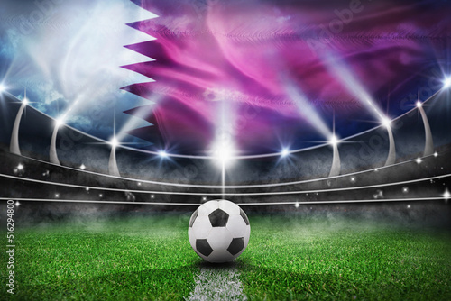 textured soccer game field with a soccer ball on the line in Qatar - center, midfield photo