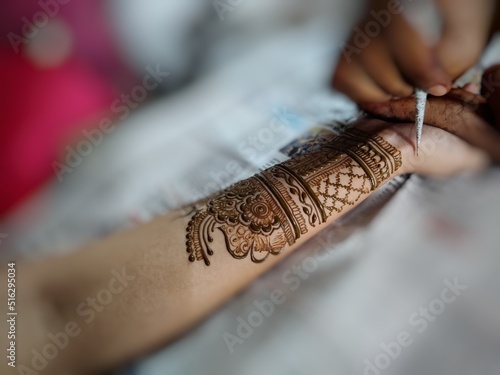 Picture of henna or mehndi design drawn on a woman's hand  © abhinavmathurindia