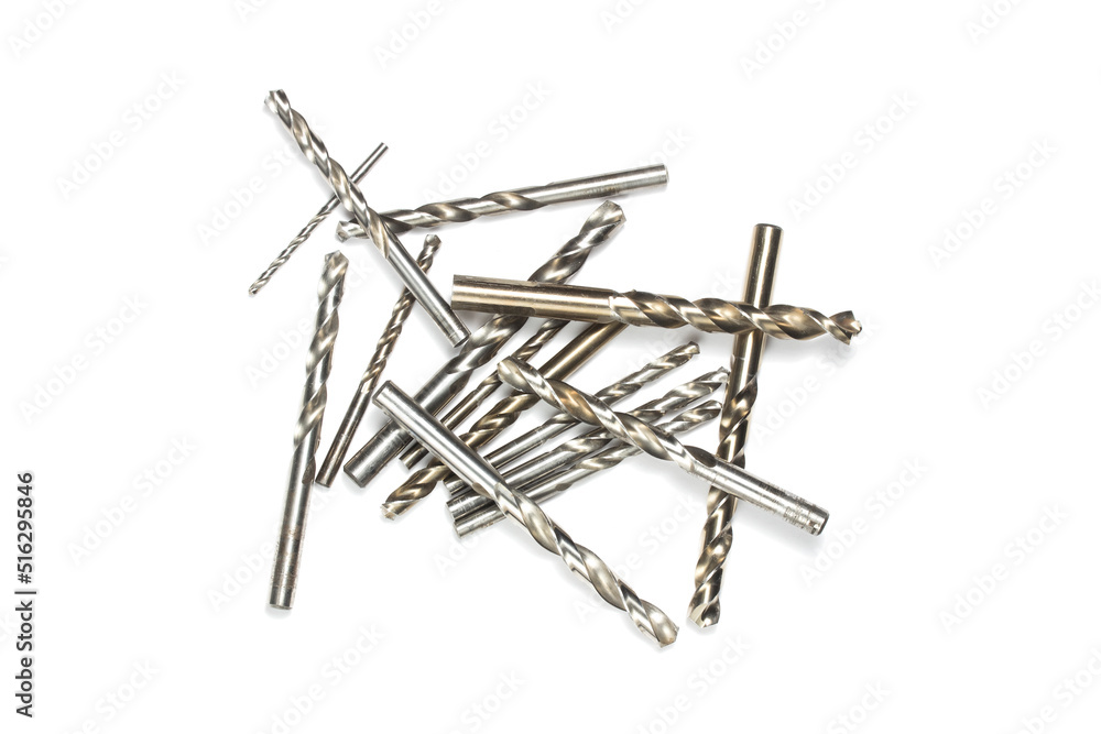 a set of drill bit of different size macro shooting on a white background. space for text a set of drill bit of different size macro shooting on a white background. space for text
